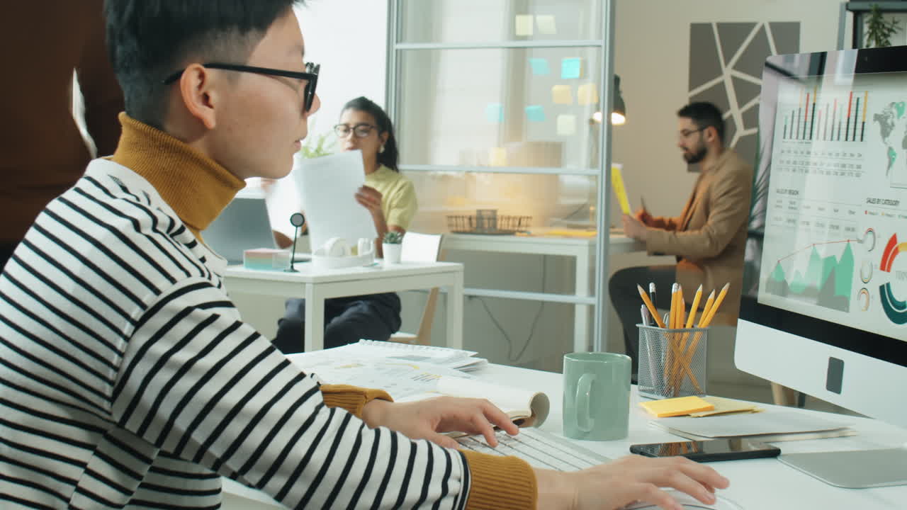 Time Lapse of Asian Businesswoman Working at Office Desk