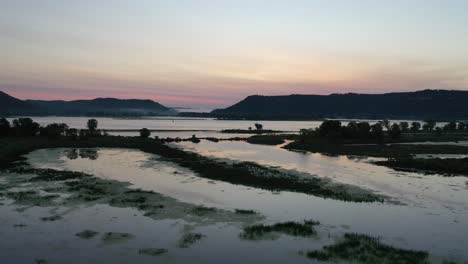 sunrise over a river with islands and marshland