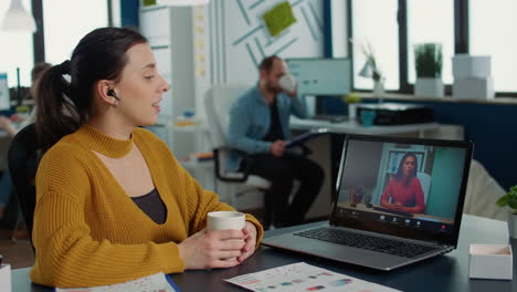 Portrait-of-business-employee-using-laptop-in-casual-video-call-conference-with-manager