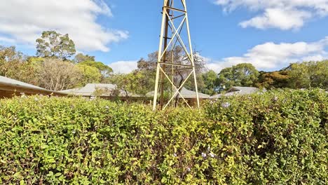 old windmill under a blue sky