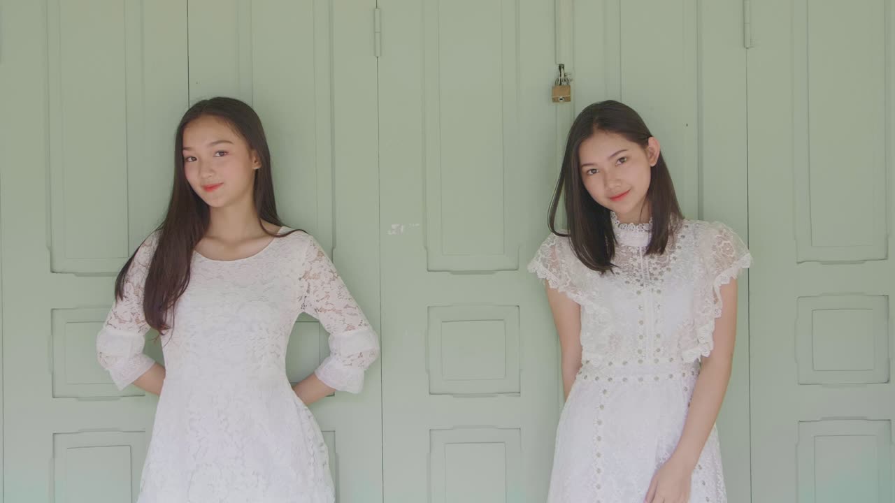 Two Cute Girls Pose In Front Of Door, Slow Motion