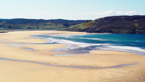 Aerial-shot-flying-over-the-beach-at-Bettyhill-on-the-North-Coast-of-Scotland-on-a-sunny-summers-day