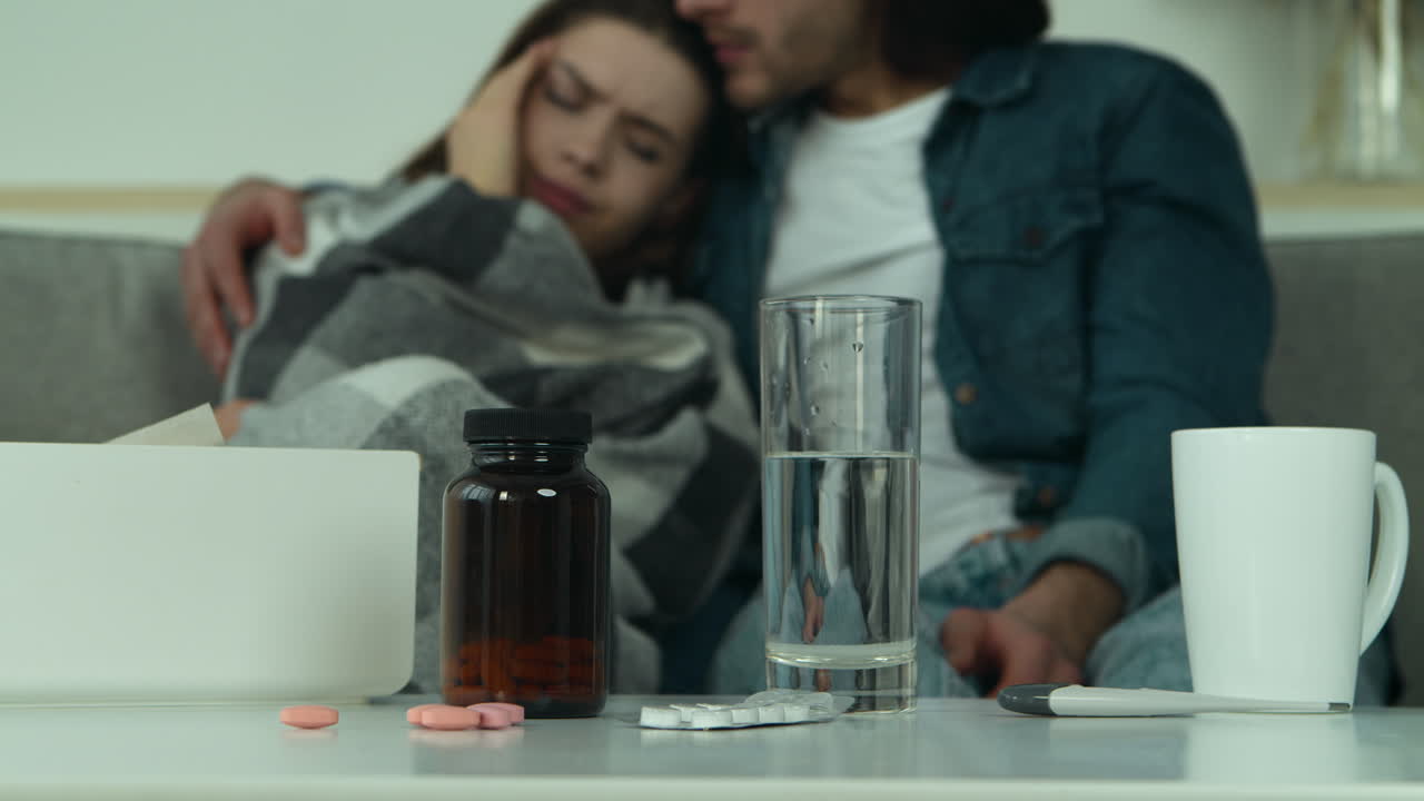 Sick Woman and Partner Taking Care