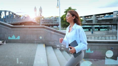 attractive young businesswoman walks up staircase along various digtally superimposed graphs, statistics, price trends and financial data