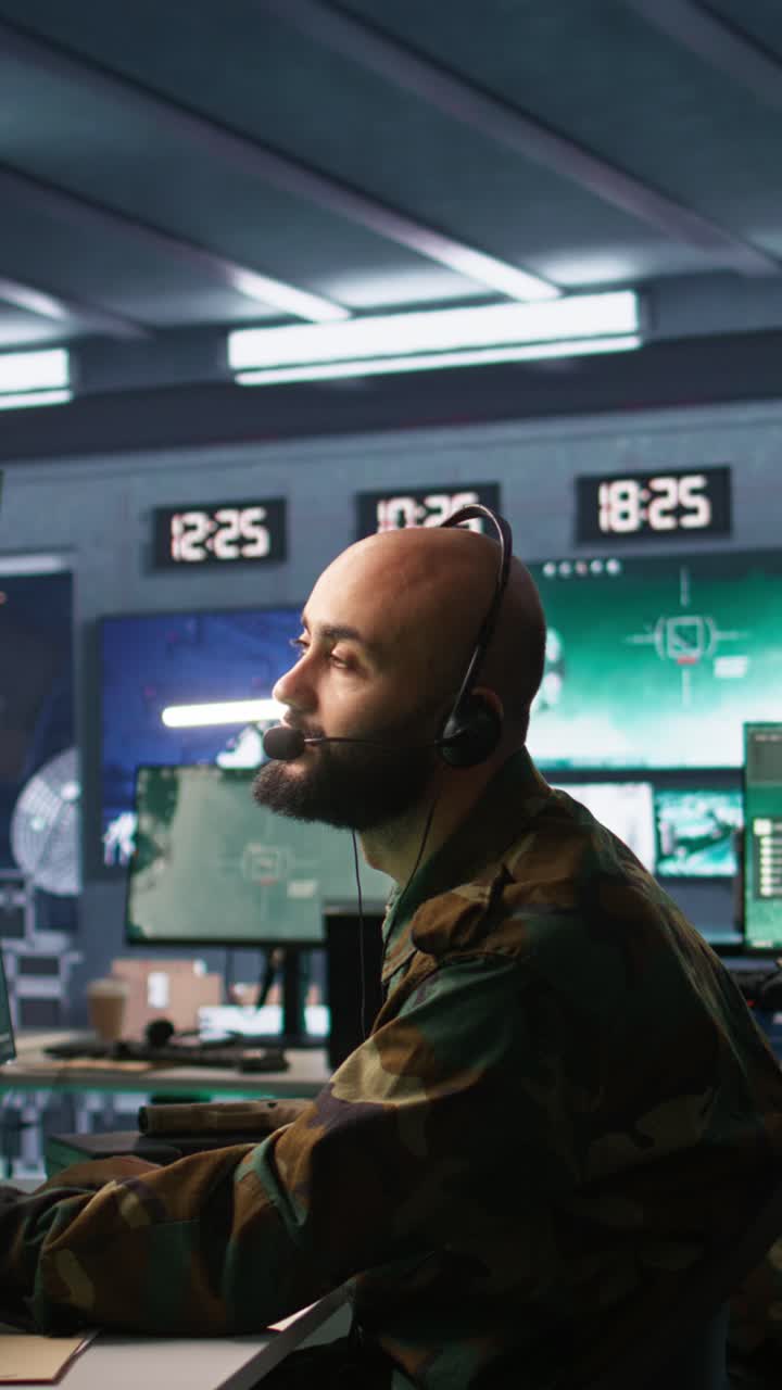 Vertical video Army telecommunication systems operator using radio and satellite equipment