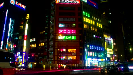 night lapse with many japanese neons at shinjuku south side tilt up