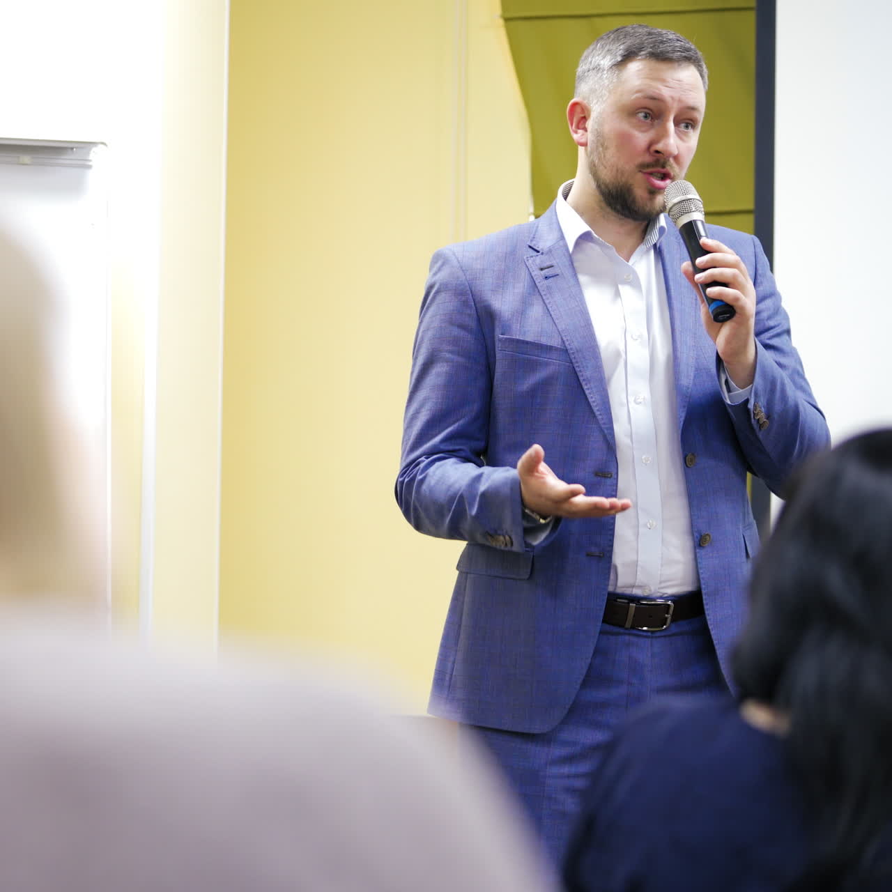young businessman at business conference room with public giving presentations. Audience at the conference hall. Entrepreneurship club