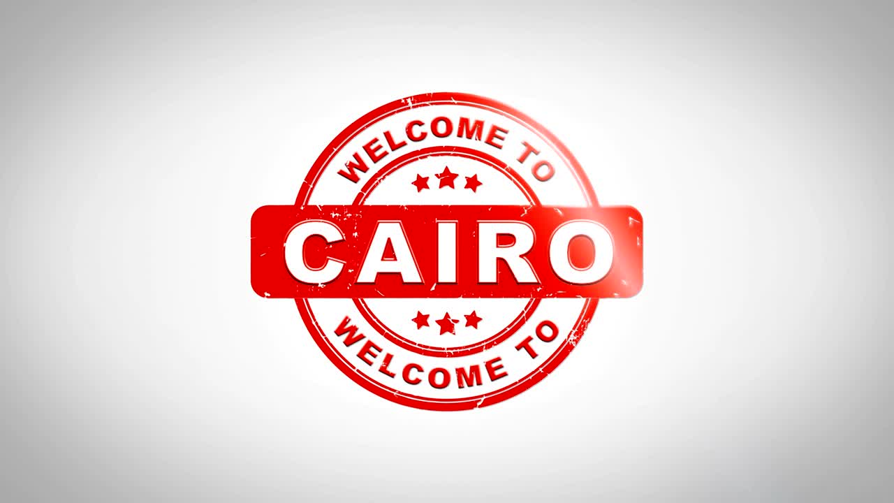 bienvenido al cairo firmado texto de estampado animación de sello de madera. tinta roja en papel blanco limpio fondo de superficie con fondo matte verde incluido.