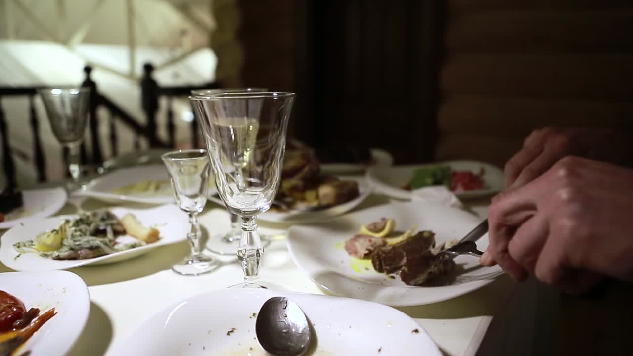 Dirty And Empty Dishes. Dirty dishes on a table in a restaurant