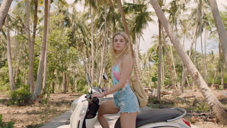 travel woman with motorcycle on tropical island confident independent female exploring freedom on vacation posing with motorbike