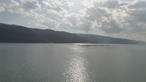 fflying over a mountain lake