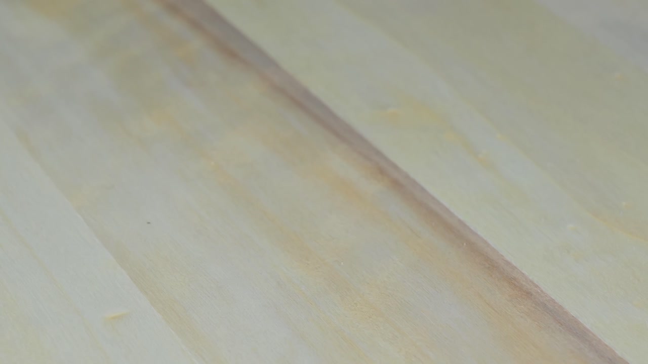 Female bare feet approach the man's feet and rise on the fingers for a kiss. Bottom view. Romantic day in the house. Valentines day. Relationships and feelings concept