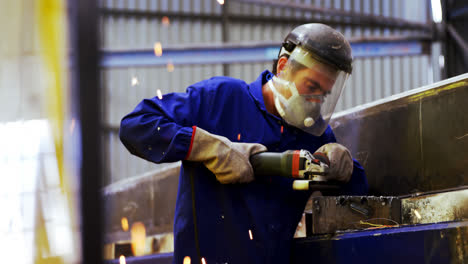 male engineer using grinder machine 4k