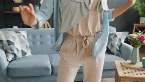 woman dancing in the living room