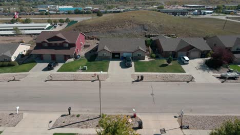 aerial shot moving down a street revealing houses