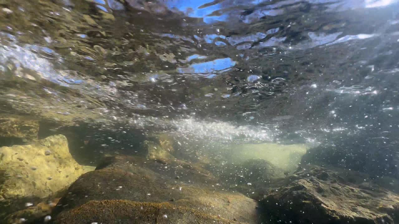 Psychedelic hypnotic underwater shot of a shallow stream in Saaremaa, Estonia.