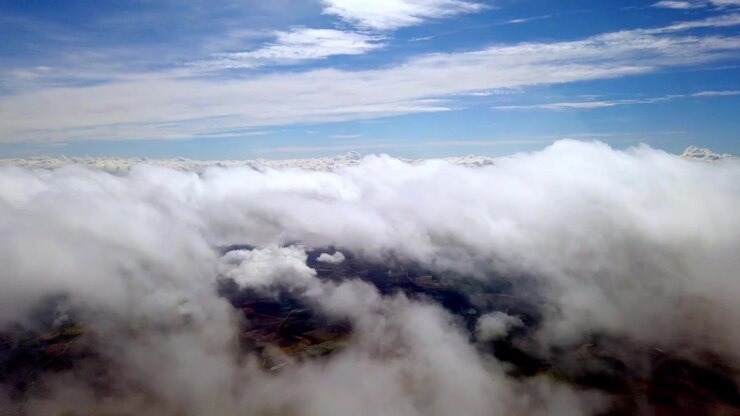 Airplane Window View Flying above a sea of clouds over Gran Canaria, Spain