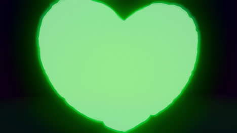 green energy heart shapes on a dark background