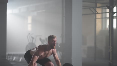 a young male weightlifter lifts a heavy barbell over his head performing a jerk. the jerk of a heavy barbell in slow motion