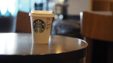 starbucks coffee cup on table