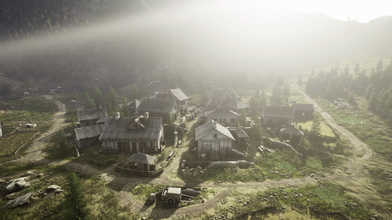 Peaceful rural village nestled in the mountains during early morning fog