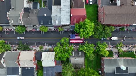 an american independence day parade marching through main street of town