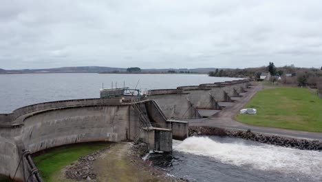 looking-across-the-spillway-along-the-length-of-the-concrete-walls-of-the-near-capacity-dam