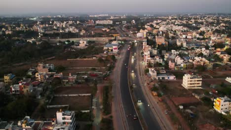 Early-Morning-Sunrise-In-a-Highway-Road-Surrounded-by-Buildings