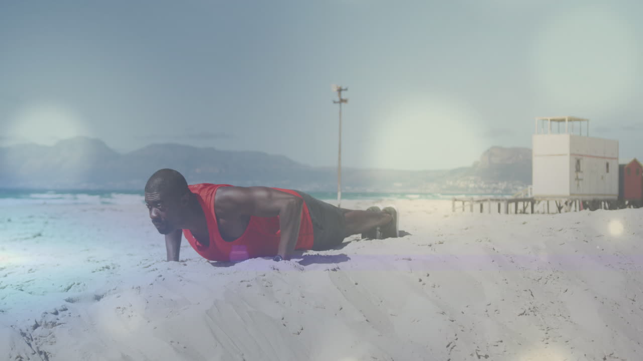 animación de puntos sobre hombre afroamericano haciendo ejercicio en la playa