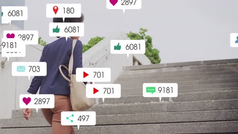 animación de iconos de las redes sociales contra la vista trasera de una mujer afroamericana subiendo las escaleras