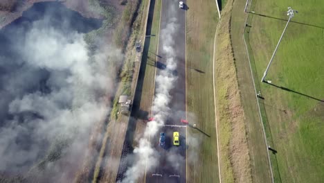 aerial view of race cars speeding on the race track at sydney motorsport park, eastern creek, australia - drone shot