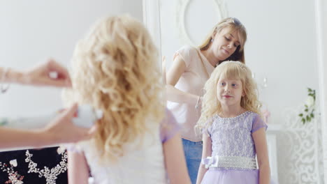 a young lady is doing an elegant hairstyle 2