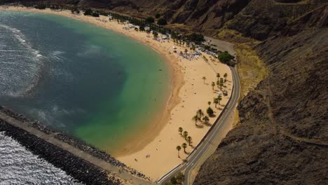 beautiful panoramic view of sandy beach in spain tenerife north of the island sahara sand drone shot in 4k