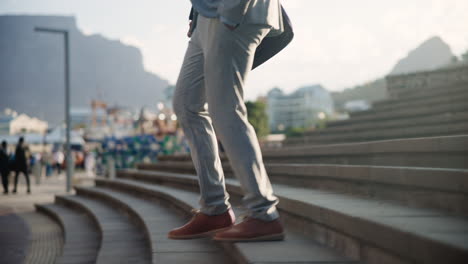 businessman walking up stairs in city