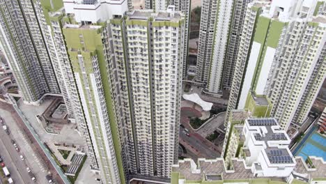 aerial shot of downtown hong kong mega residential skyscrapers and traffic, on a beautiful day