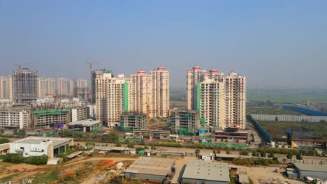 aerial drone shot capturing a massive high rise construction site in noida india