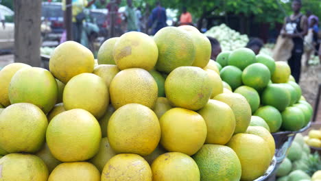 pile of grapefruit or pomelo at the outdoor makurdi, nigeria fruit market