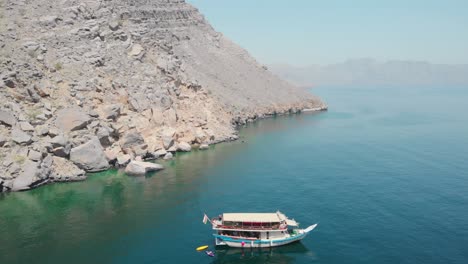 aerial shot from drone of a dhow cruise in gulf of oman, khasab