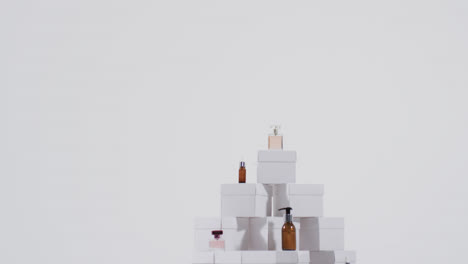 video of beauty products with white cardboard boxes with copy space over white background