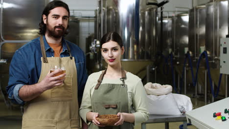 man and woman at brewery