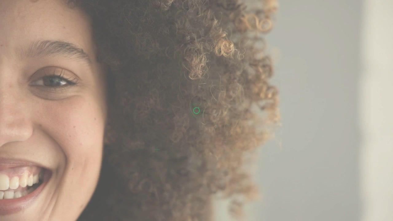 Woman watching intensifying green HUD rings, smiling and reacting for technology UX demo