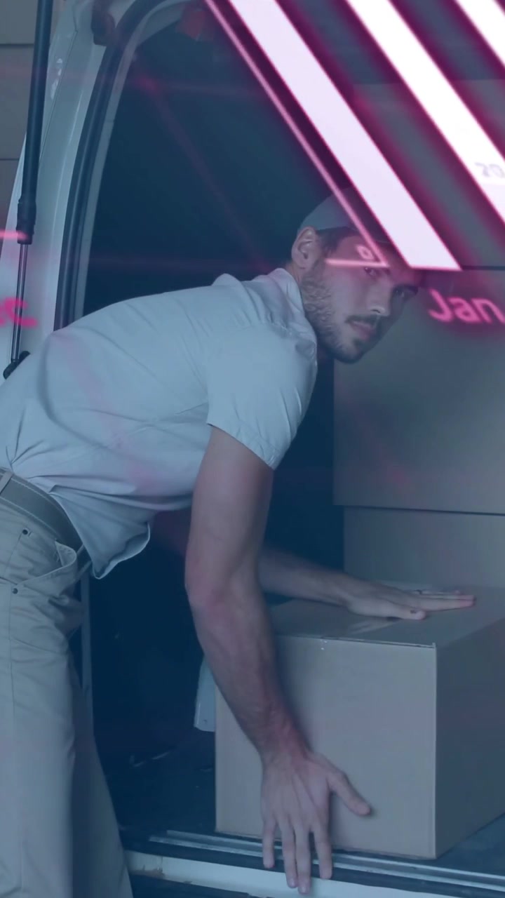 Vertical video: Reaching into van courier lifting boxes for delivery neon-pink overlay sweeping
