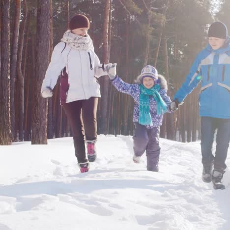 Mother-Walks-With-Her-Two-Children-In-Snow-05
