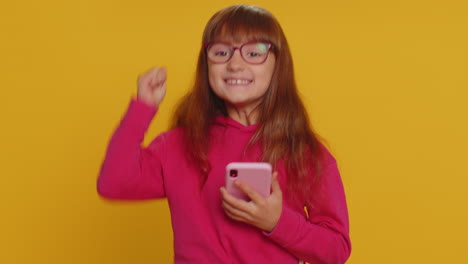 Child-girl-kid-use-mobile-smartphone-browsing-say-Wow-yes-found-out-great-win-good-news-celebrate