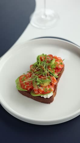 delicious salmon toast with avocado and tomato