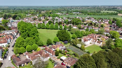 Pull back drone aerial reverse reveal Writtle Village Essex UK