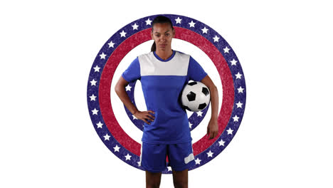 portrait of african american female soccer player holding a ball against stars on spinning circles