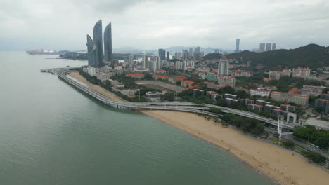 baicheng beach heading towards shimao strait towers in xiamen china
