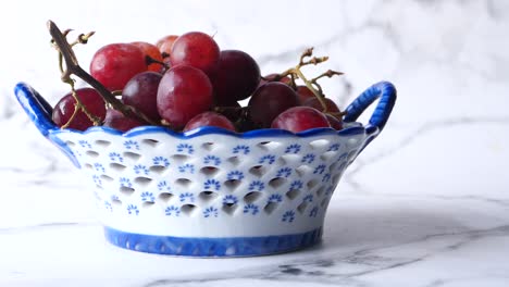 red grapes in a decorative bowl