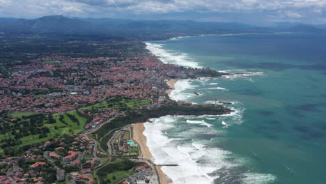 aerial-view-Bay-of-Biscay-Biarritz-lighthouse-rocher-de-la-vierge-sunny-windy